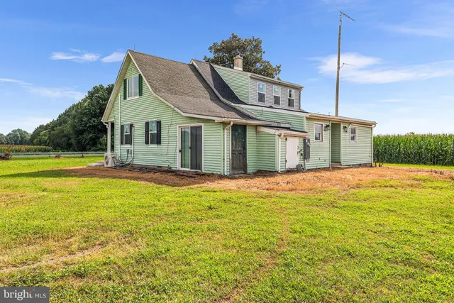 a view of a table and chairs in the garden