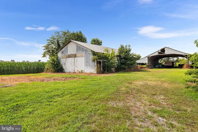 a view of a room with furniture and wooden floor