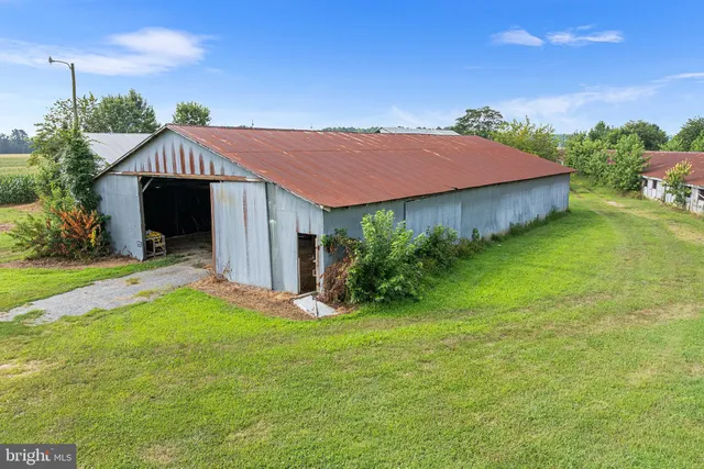 a view of room with furniture and wooden floor
