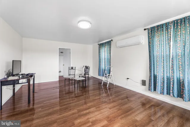 a workspace with furniture and wooden floor