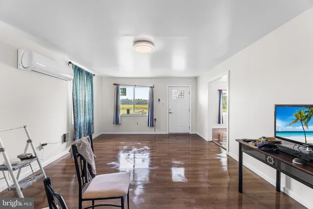 a view of a hardwood & hallway