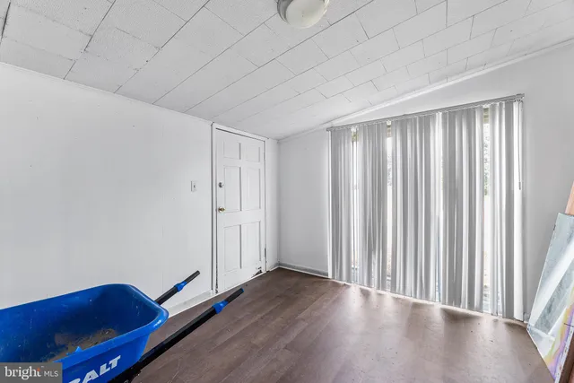 a bathroom with a sink mirror and shower