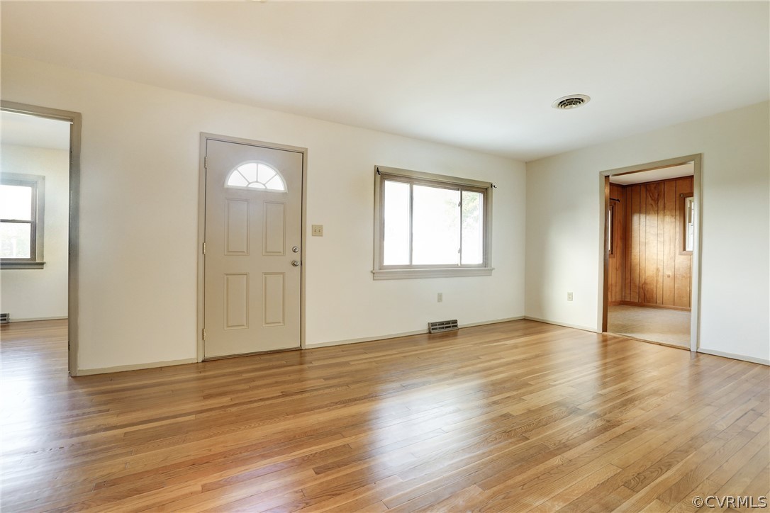6228 Cross County Road Mineral, VA 23117 - Photo 11 of 26 an empty room with wooden floor and windows