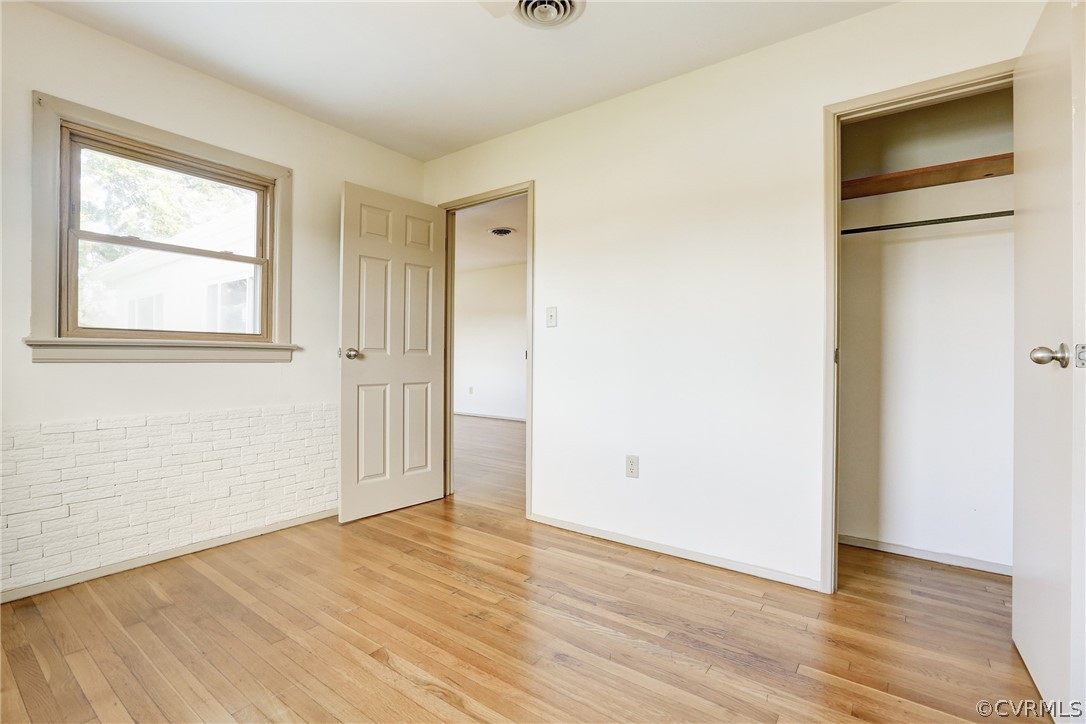 6228 Cross County Road Mineral, VA 23117 - Photo 20 of 26 an empty room with wooden floor and windows