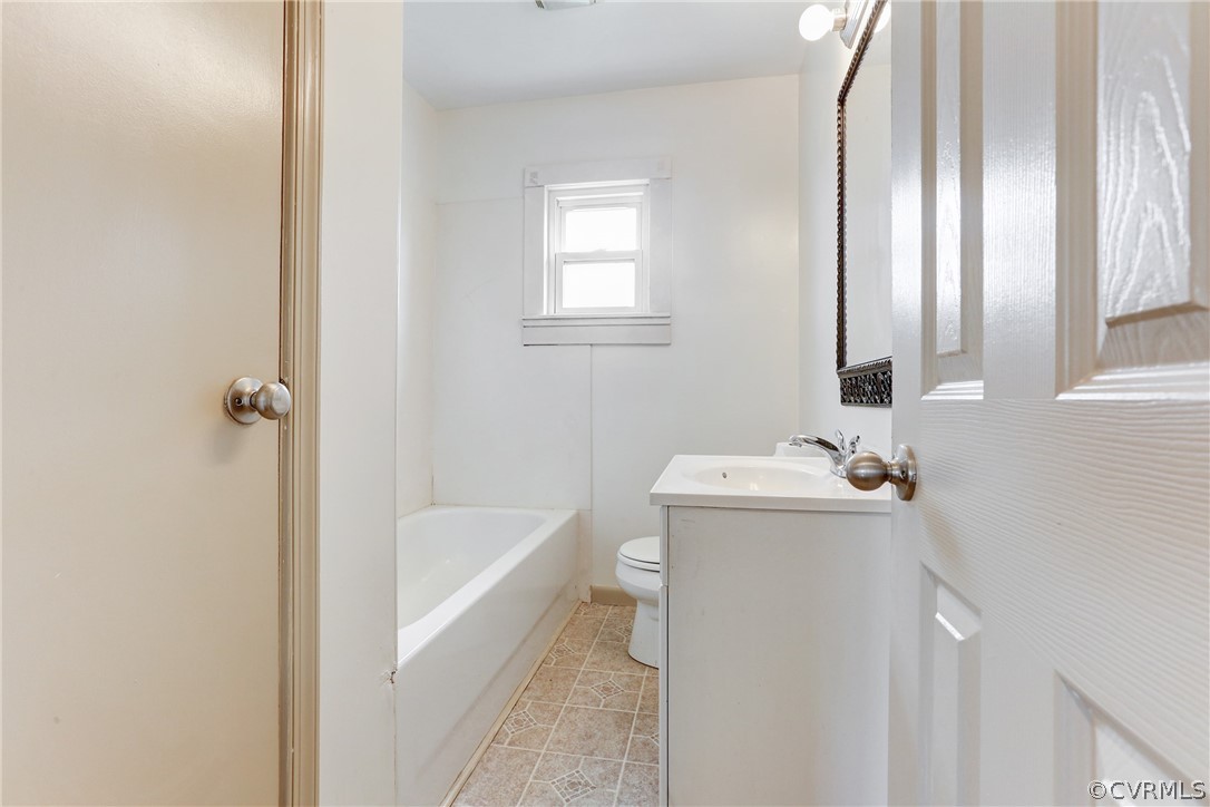 6228 Cross County Road Mineral, VA 23117 - Photo 25 of 26 a bathroom with a sink a toilet and tub