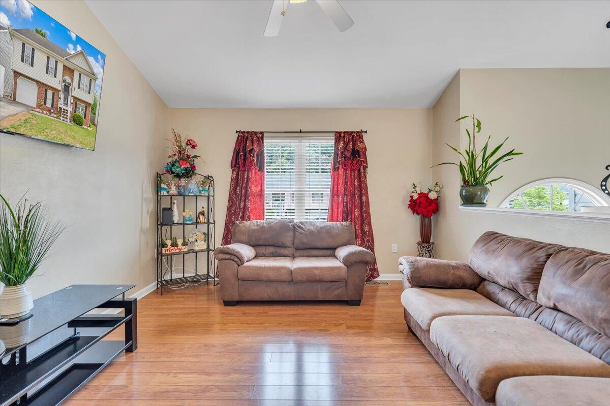 4751 Westvale Road Northeast Roanoke, VA 24019 - Photo 4 of 30 a living room with furniture and a potted plant