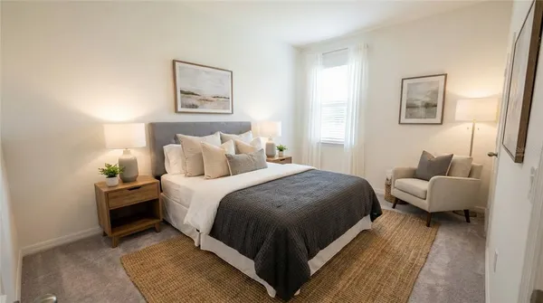 a bedroom with bed and a couch