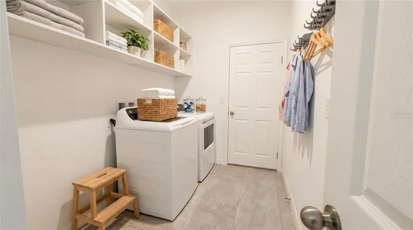 a utility room with dryer and washer
