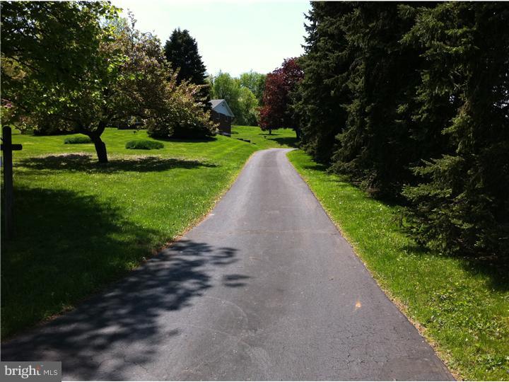 3270 Gallows Hill Road Riegelsville, PA 18077 - Photo 2 of 7 a view of a street with a big yard