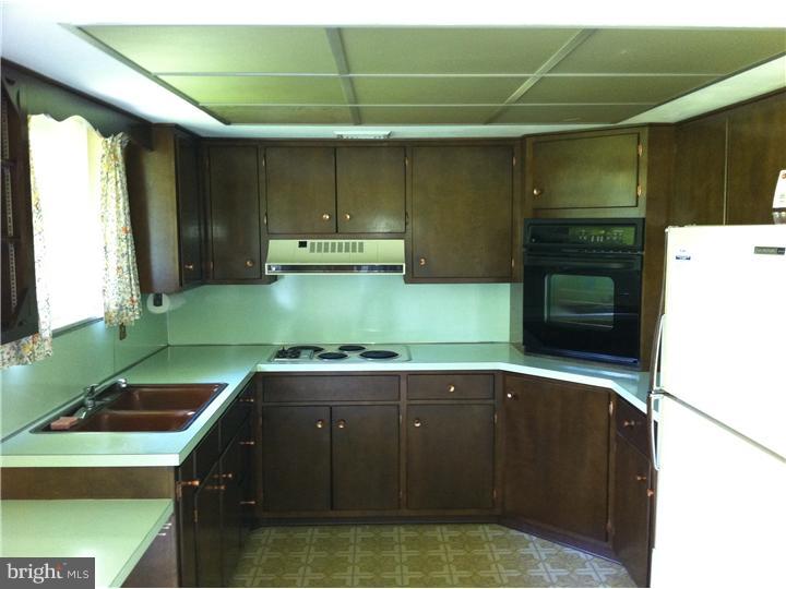 3270 Gallows Hill Road Riegelsville, PA 18077 - Photo 6 of 7 a kitchen with a sink and a microwave
