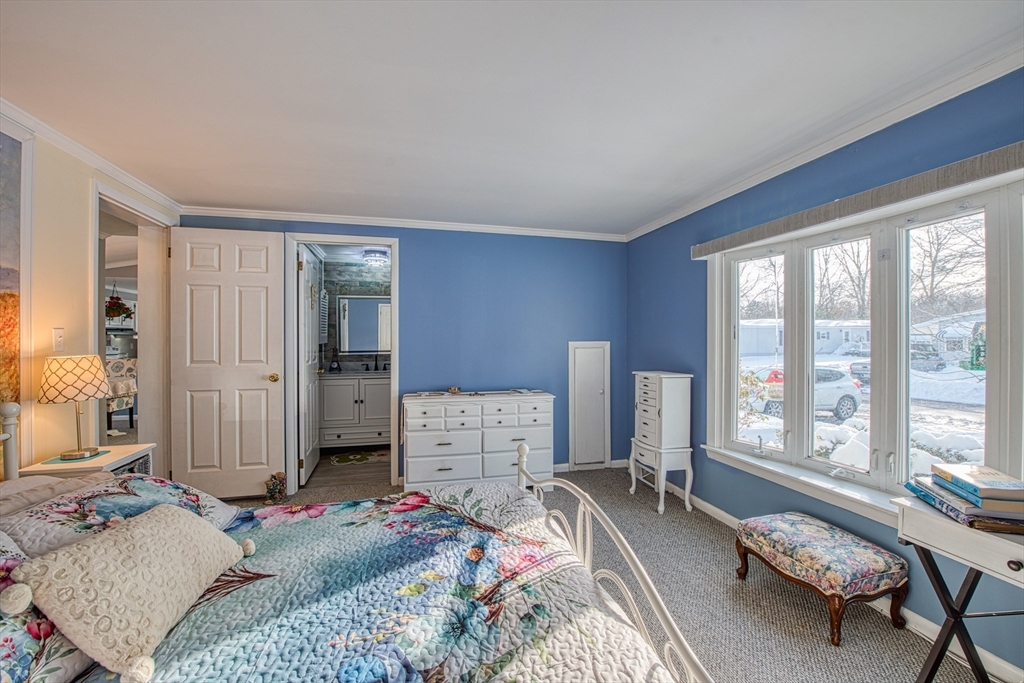 191 Red Oak Terrace Taunton, MA 02780 - Photo 12 of 28 a bedroom with a bed and large windows