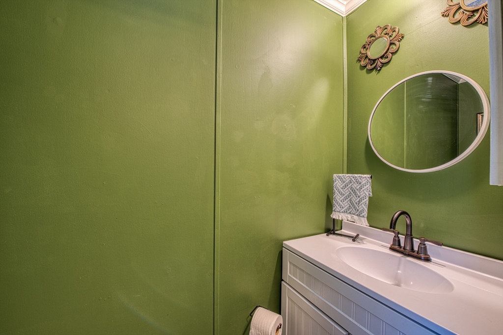 191 Red Oak Terrace Taunton, MA 02780 - Photo 15 of 28 a bathroom with a sink and a mirror