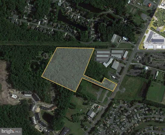 an aerial view of a house with lake view and a yard