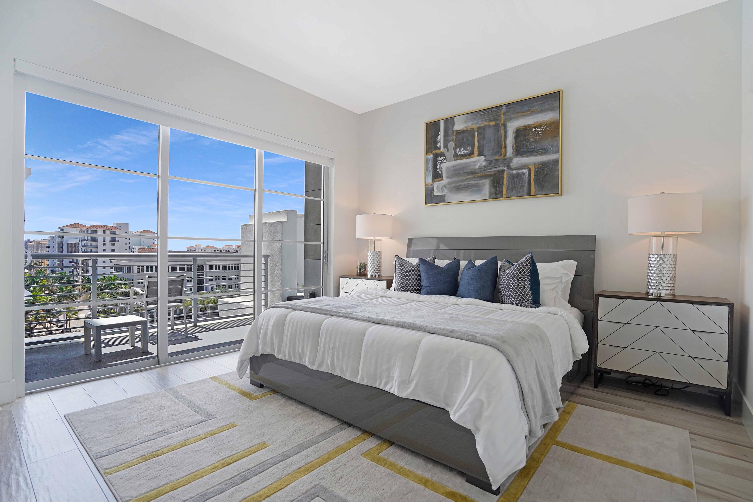 155 East Boca Raton Road, Unit 916 Boca Raton, FL 33432 - Photo 13 of 72 a bedroom with a large bed and a night stand