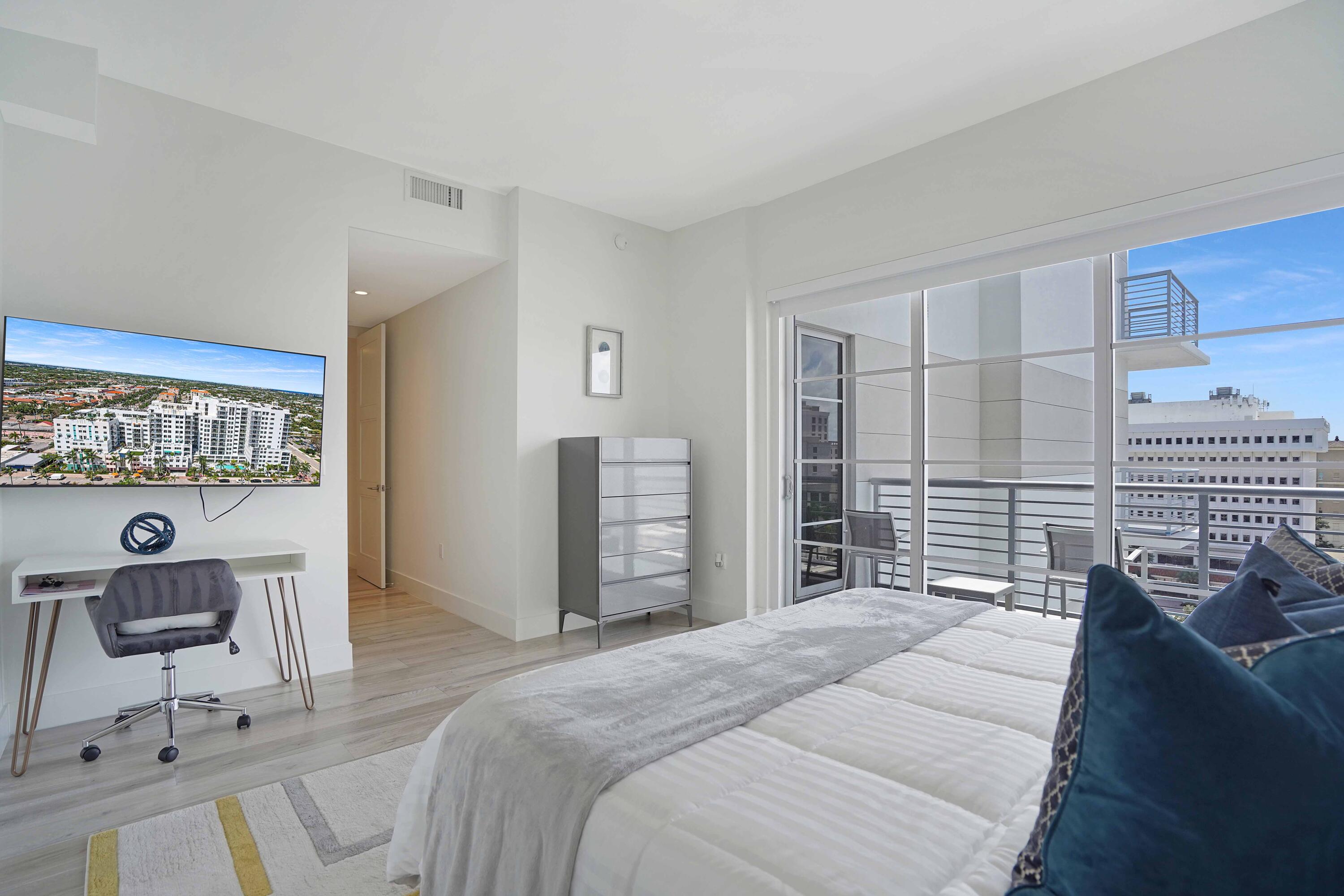 155 East Boca Raton Road, Unit 916 Boca Raton, FL 33432 - Photo 14 of 72 a bedroom with a bed and a large window