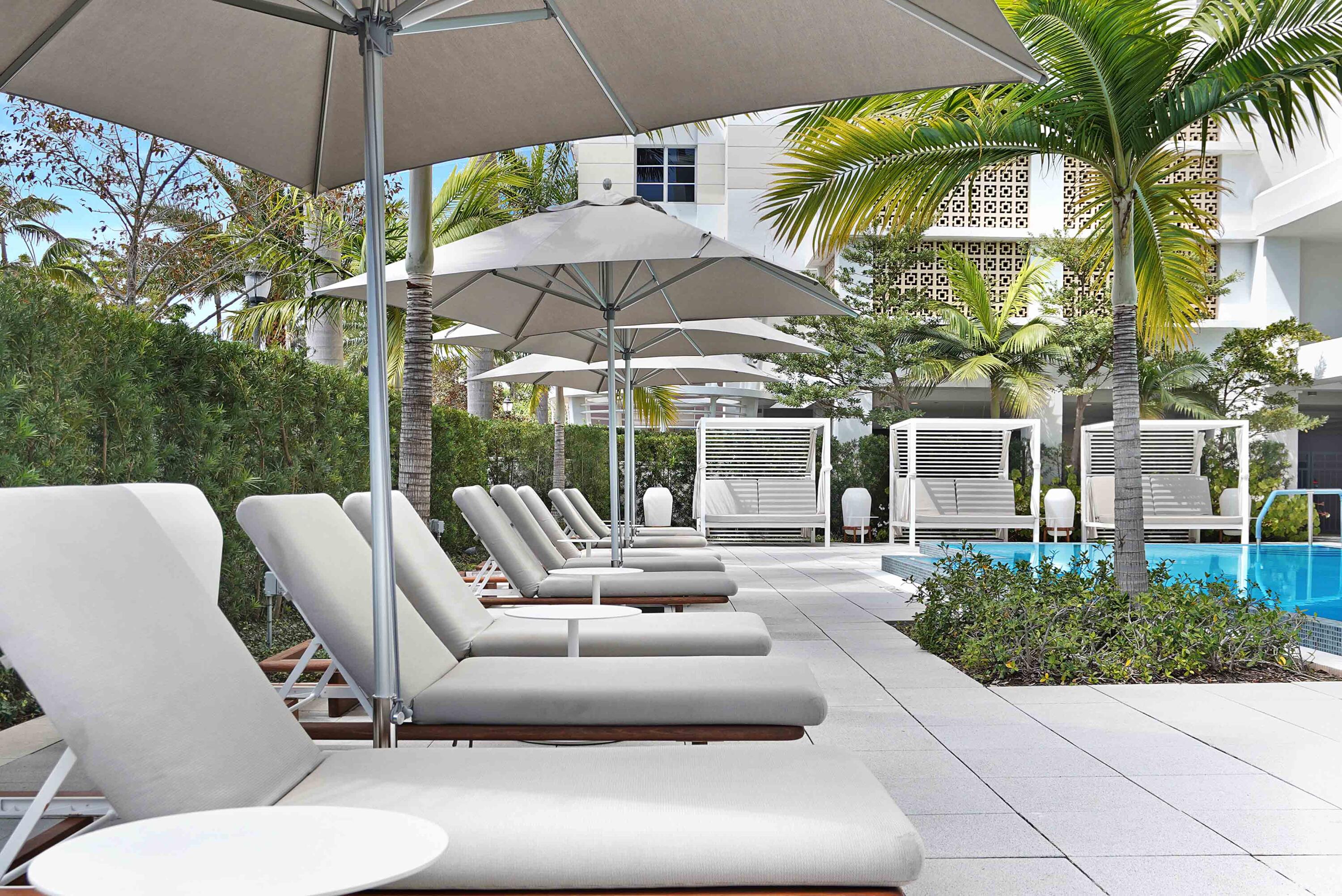 155 East Boca Raton Road, Unit 916 Boca Raton, FL 33432 - Photo 49 of 72 a view of a patio with couches under an umbrella