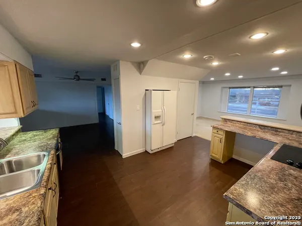 a view of a kitchen with furniture and a kitchen