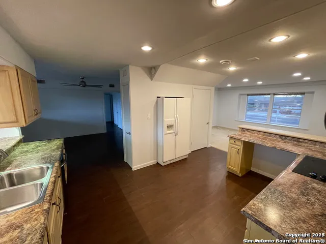 a view of a kitchen with furniture and a kitchen