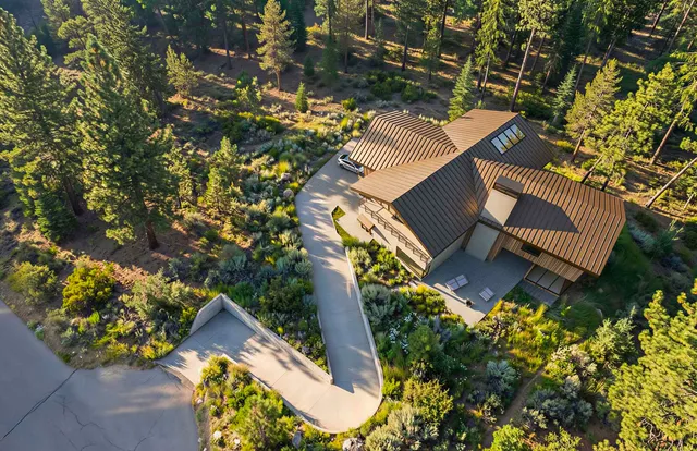 a view of a house with a yard and sitting area