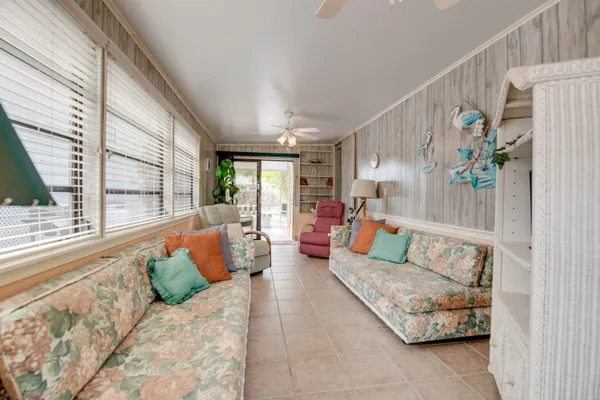 a balcony with furniture and a potted plant