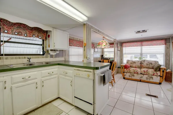 a kitchen with cabinets and outdoor view