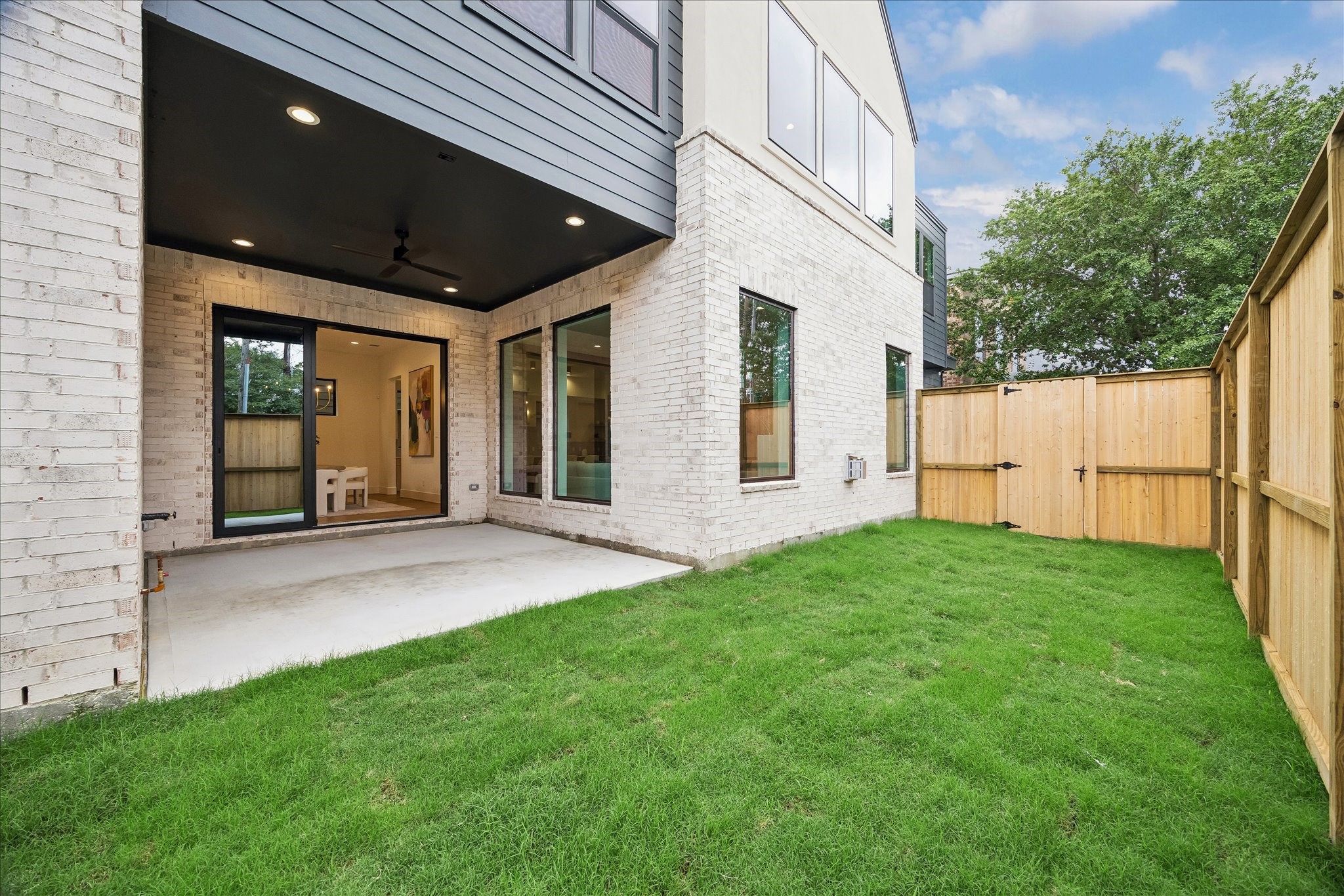 122 East 4th Street Houston, TX 77007 - Photo 35 of 38 Backyard - offers large covered patio with ceiling fan and recessed lighting.