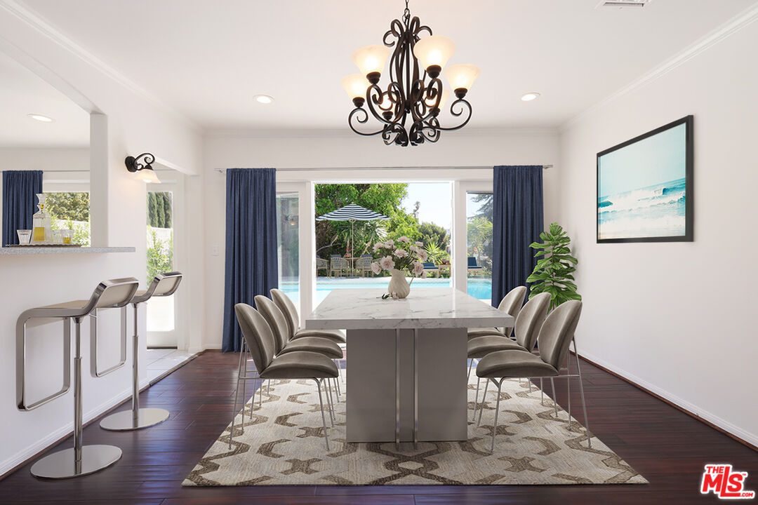 600 Luton Drive Glendale, CA 91206 - Photo 2 of 42 a dining room with wooden floor a chandelier a glass table and chairs