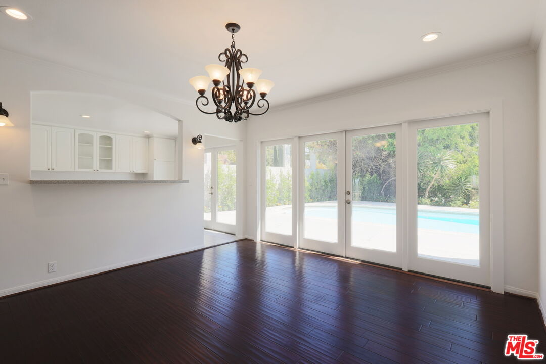 600 Luton Drive Glendale, CA 91206 - Photo 27 of 42 a view of an empty room with wooden floor and a window