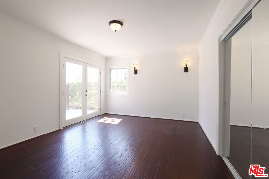 600 Luton Drive Glendale, CA 91206 - Photo 31 of 42 an empty room with wooden floor and windows