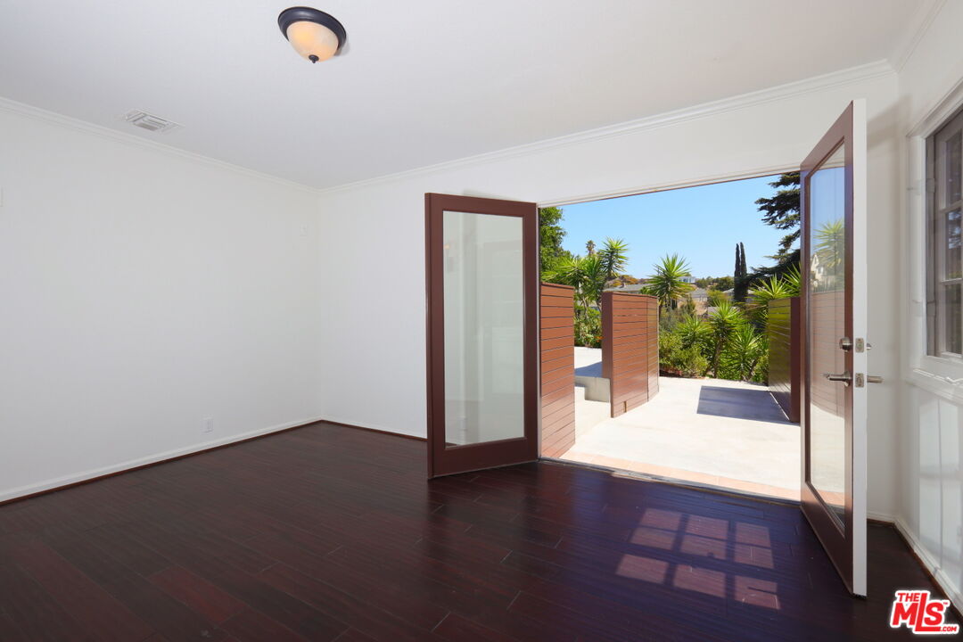 600 Luton Drive Glendale, CA 91206 - Photo 32 of 42 an empty room with wooden floor and windows
