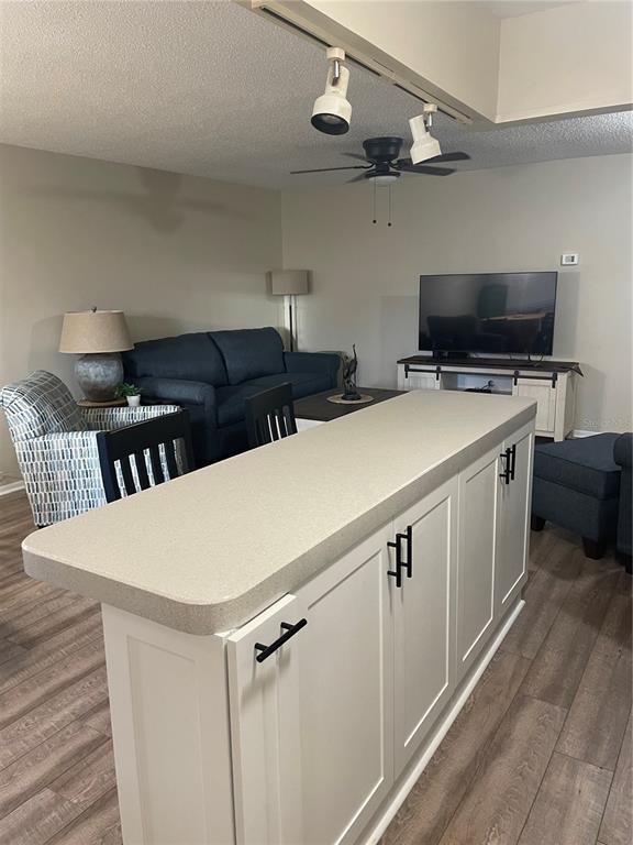 14531 Walsingham Road, Unit 203 Largo, FL 33774 - Photo 11 of 24 a utility room with cabinets