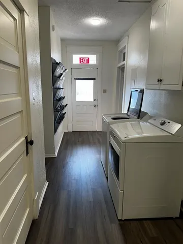 a kitchen with granite countertop a stove and a refrigerator