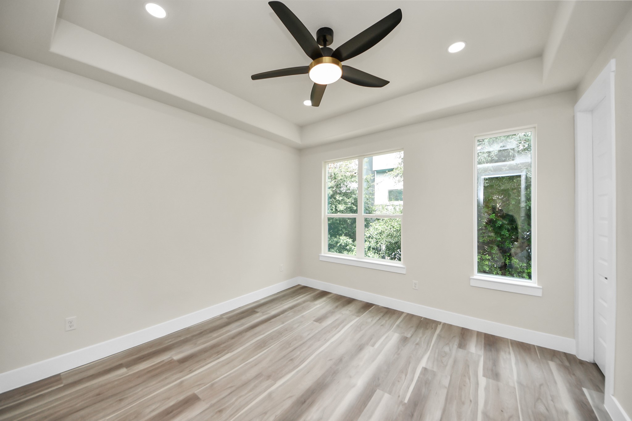2014 Blodgett Street Houston, TX 77004 - Photo 25 of 49 an empty room with wooden floor and windows