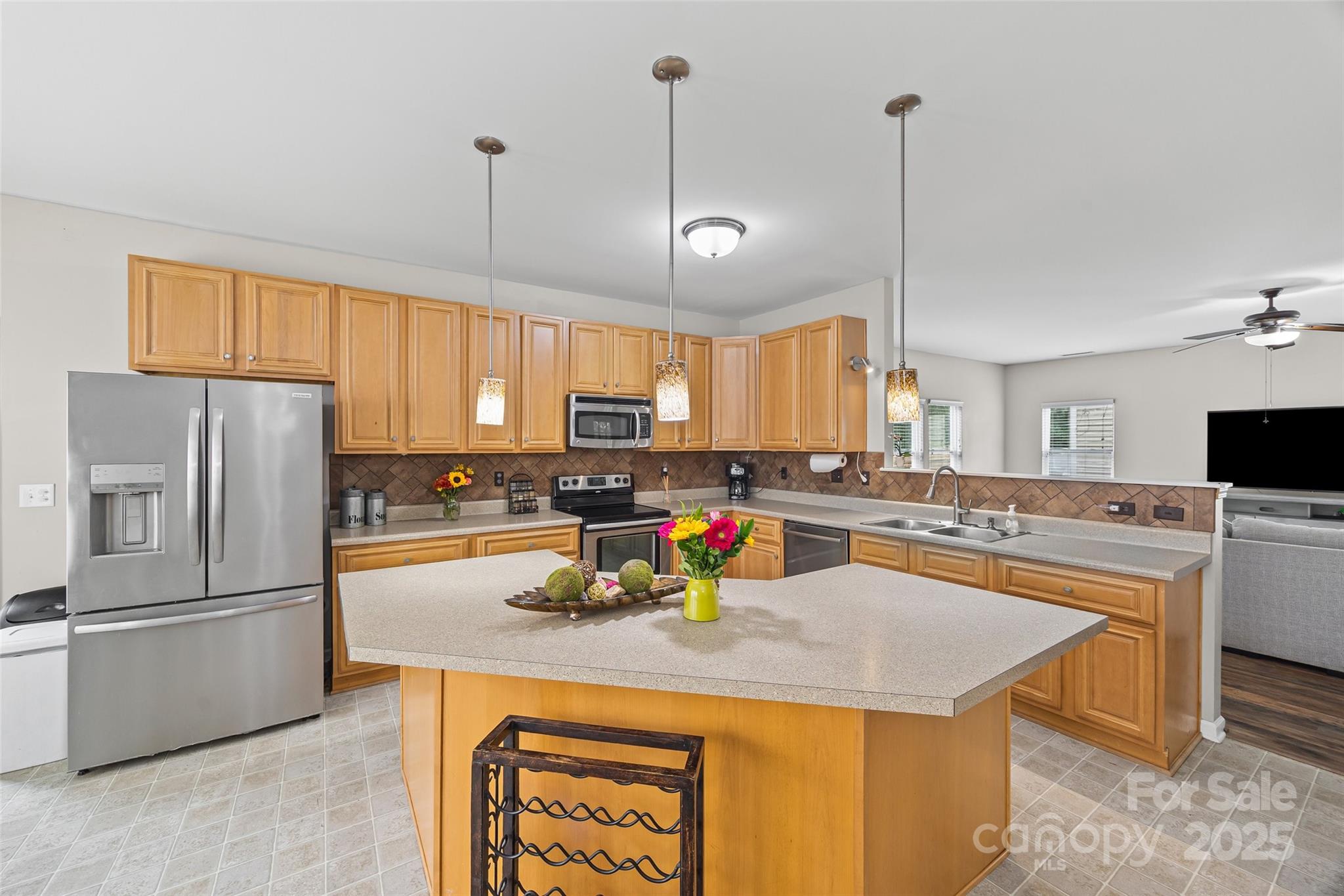 611 Pondway Downs Rock Hill, SC 29730 - Photo 16 of 43 a kitchen with stainless steel appliances granite countertop a sink a stove and a refrigerator