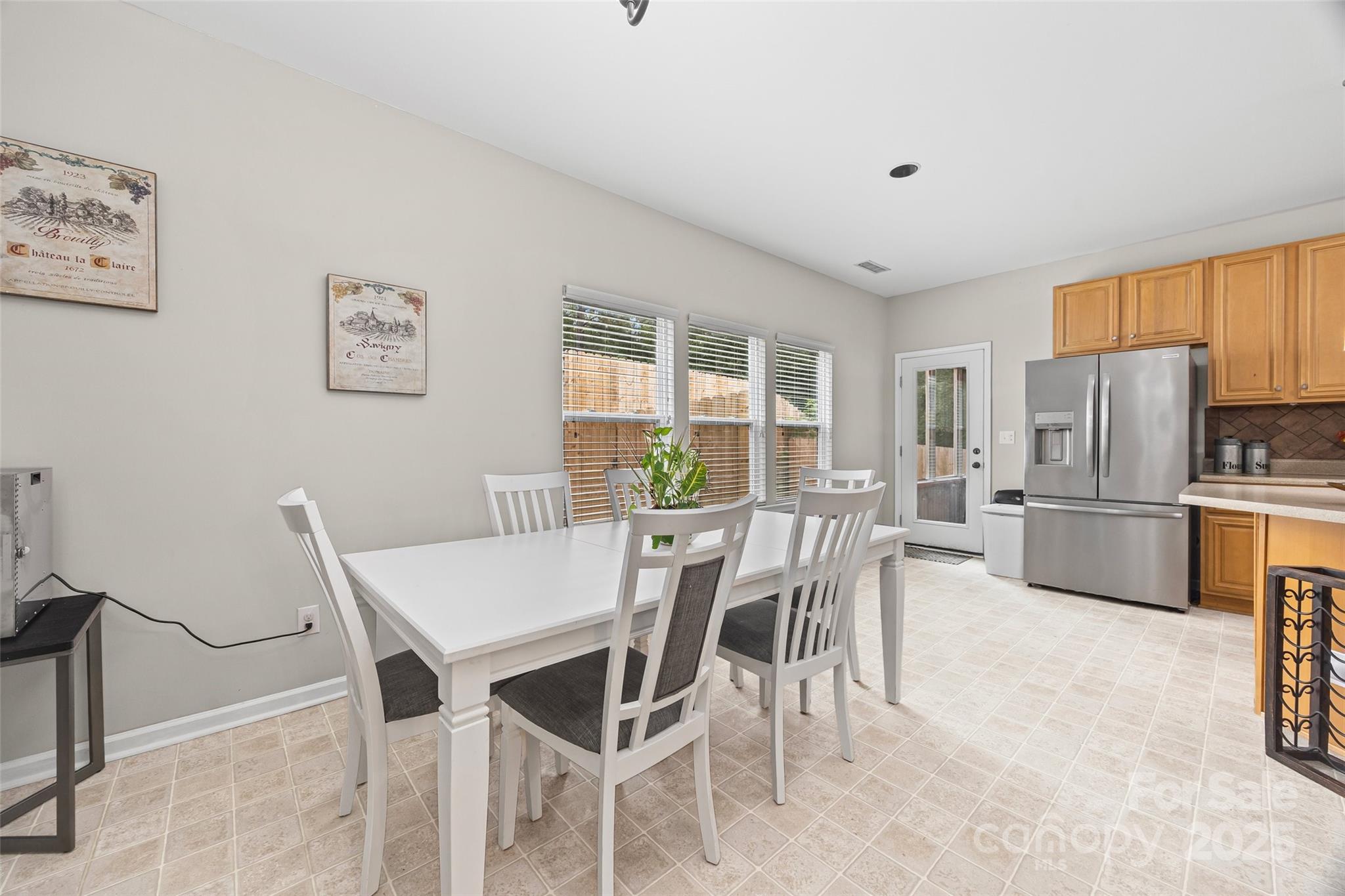 611 Pondway Downs Rock Hill, SC 29730 - Photo 18 of 43 a view of a dining room with furniture and a refrigerator
