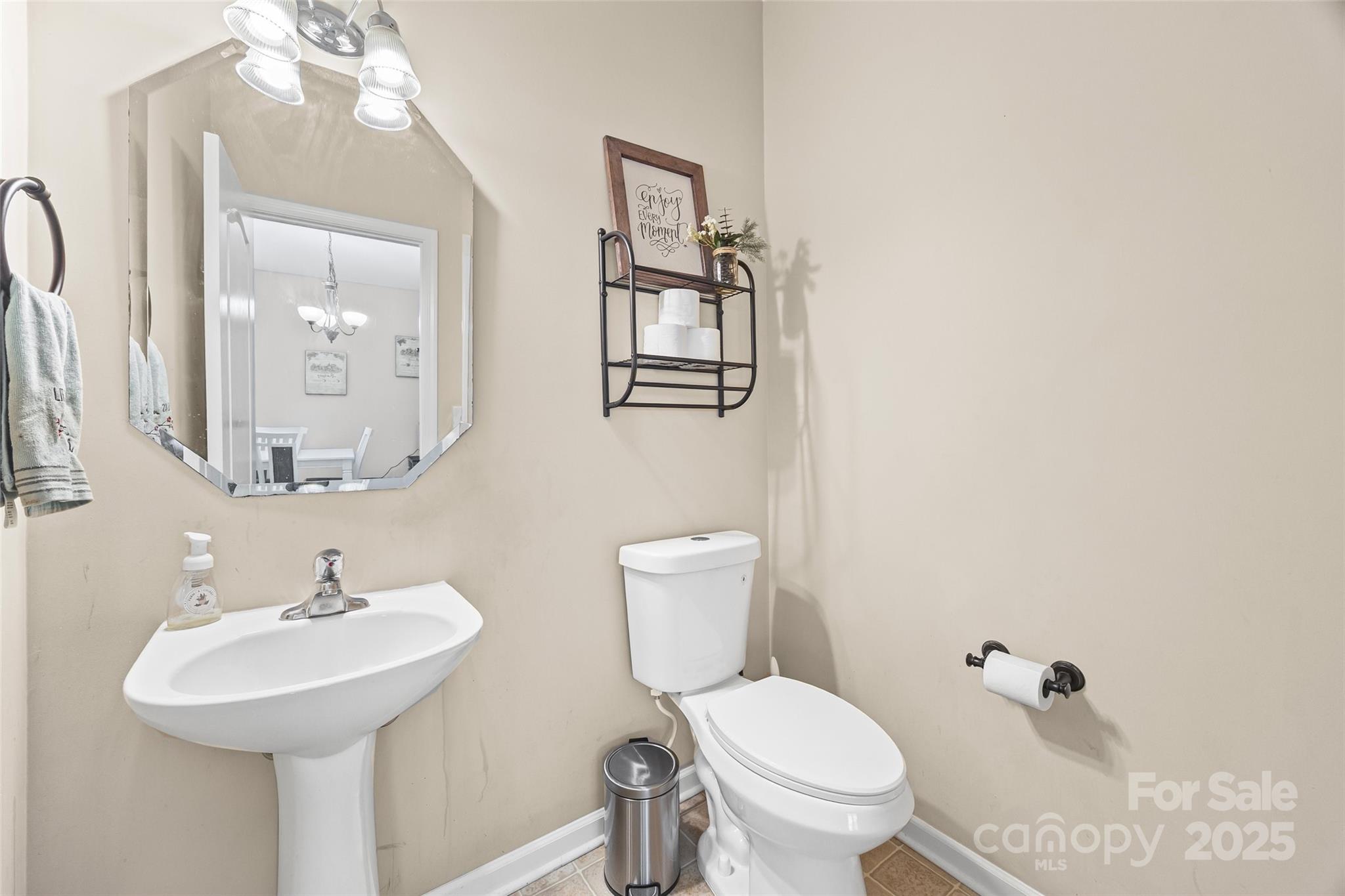 611 Pondway Downs Rock Hill, SC 29730 - Photo 19 of 43 a bathroom with a toilet a sink and mirror