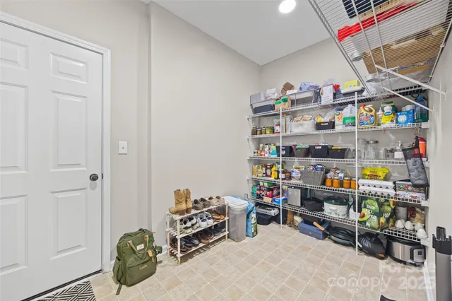 a room with storage and a white wooden cabinets