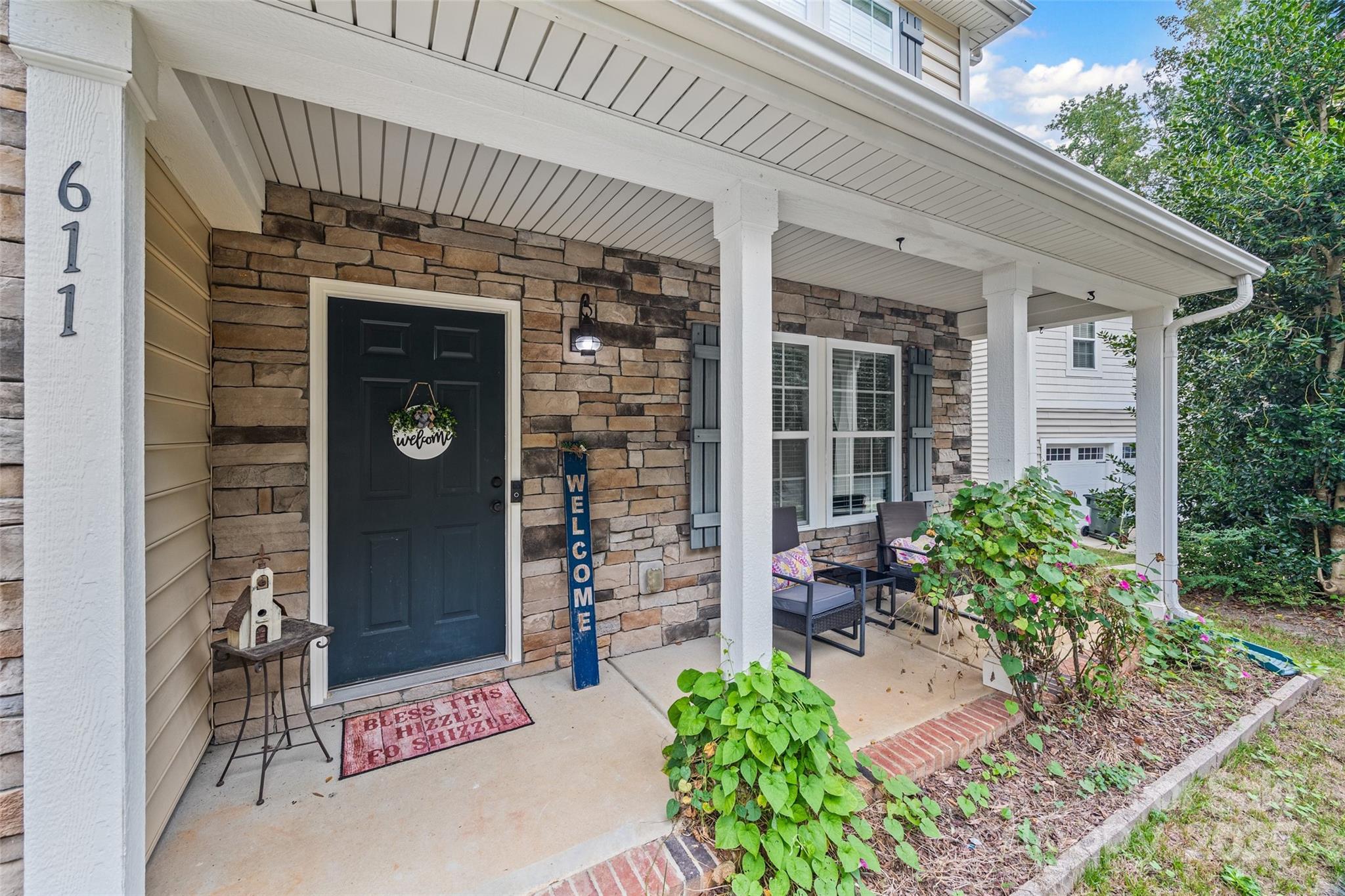 611 Pondway Downs Rock Hill, SC 29730 - Photo 2 of 43 a front view of a house with garden