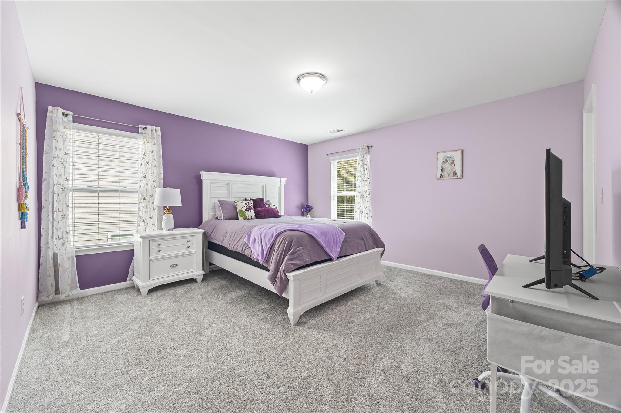 611 Pondway Downs Rock Hill, SC 29730 - Photo 23 of 43 a bedroom with a bed and a flat screen tv