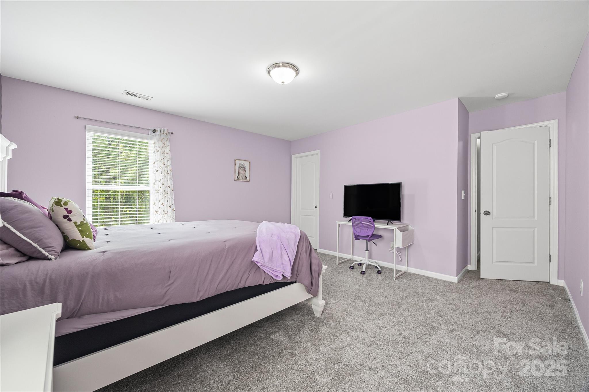 611 Pondway Downs Rock Hill, SC 29730 - Photo 24 of 43 a bedroom with a bed and a flat screen tv