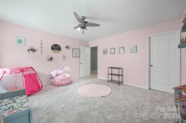 a bedroom with a bed and cabinets