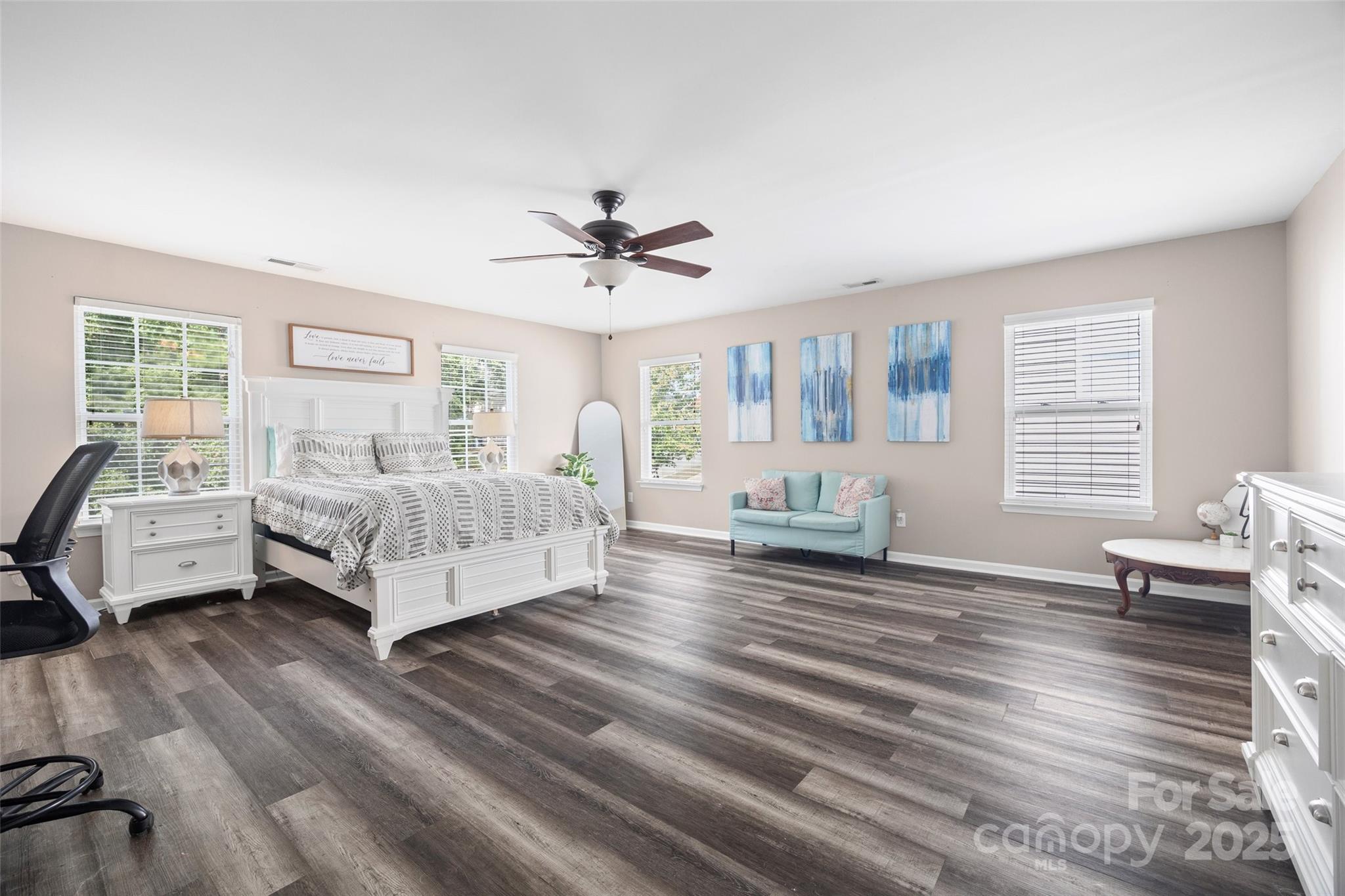 611 Pondway Downs Rock Hill, SC 29730 - Photo 30 of 43 a spacious bedroom with a bed a couch and a large window