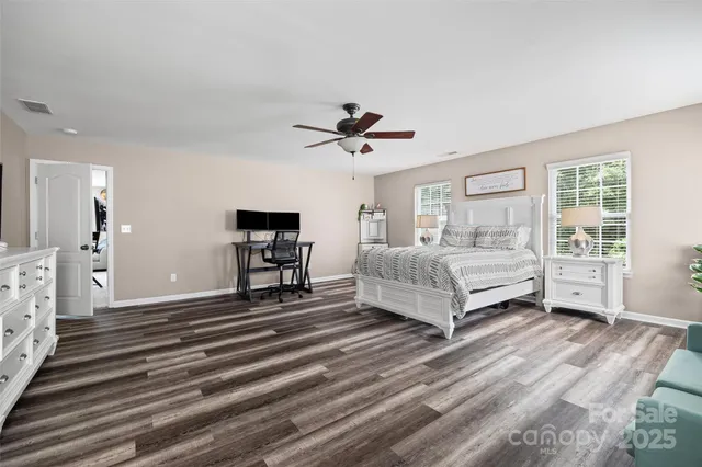 a room with a bed and a table in it