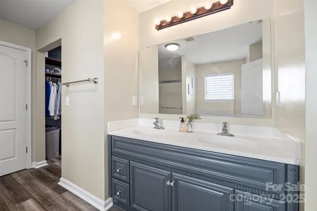 a bathroom with a double vanity sink mirror and double