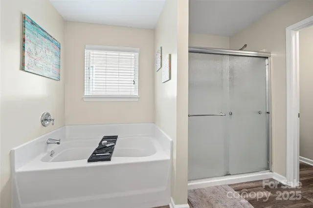 a bathroom with a tub and a sink
