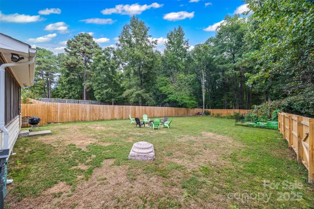 a backyard of a house with lots of green space