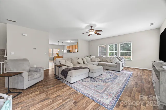 a living room with furniture and a rug