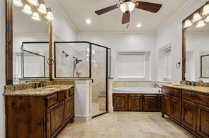 961 Deer Run Prosper, TX 75078 - Photo 11 of 12 a bathroom with a double vanity sink a mirror and a bathtub