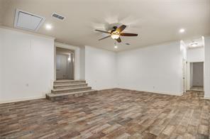 961 Deer Run Prosper, TX 75078 - Photo 6 of 12 a view of an empty room with a ceiling fan