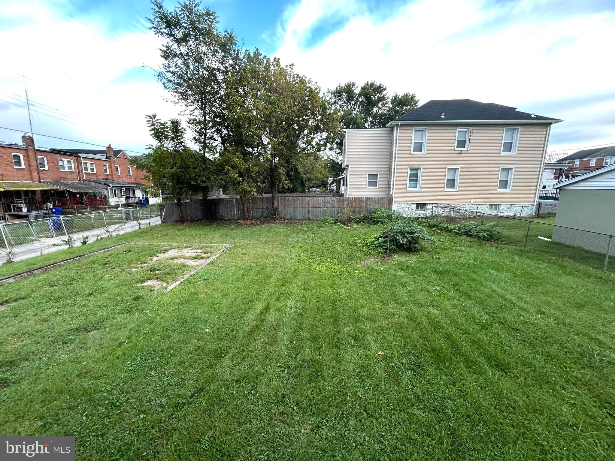 3902 West Rogers Avenue, Unit 2 Baltimore, MD 21215 - Photo 15 of 15 a bathroom with a sink and mirror